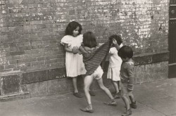 cavetocanvas:  Helen Levitt, New York (A boy lifting up a girls dress in front of other children), 1942