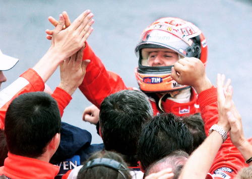 CANADA, 2000 — Michael Schumacher, 1st position, celebrates with his team. (Photo by Timothy A. Clar