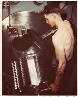 historicaltimes:  Fire Controlman First Class E.M.Smith opening the breech of one of USS Missouri’s  nine 16&quot;/50 Mk.VII main battery guns, during her shakedown cruise, August 1944 via reddit