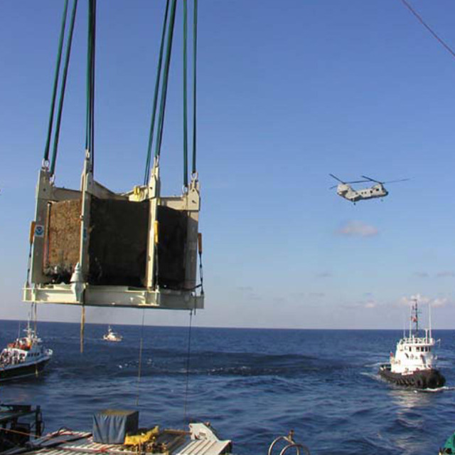 Underwater view of divers completing operation to recover USS Monitor's gun turret from the ocean floor. Photo credit: NOAA, Monitor Collection