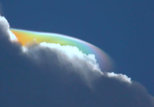 nubbsgalore:  iridescent pileus cloud photos by esther havens in ethiopia, becky bone dunning in jamaica, ken rotberg in florida, and david lapuma. as a cumulus cloud containing warm air convects upwards and condenses, a thin layer of humid air containing