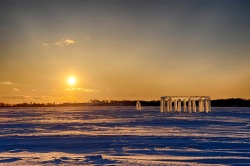 sixpenceee:Kevin Lehner, along with four other guys, created this Icehenge. Each piece was cut and pulled from the belly of the frozen lake. Using chainsaws, ice cutters, and tongs they built this homage to Stonehenge in two days. 