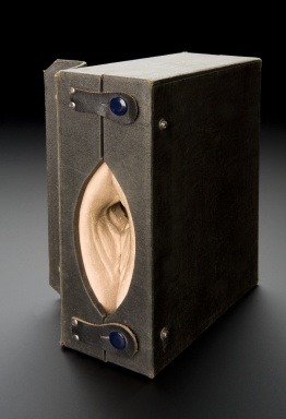 ‘Gynaeplaque’ model, United States, 1925-1935. Medical professionals were taught how to insert a cervical cap using this model. The model is spongy rubber in a black case which opens to show the female reproductive organs. A cervical cap is