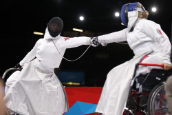 modernfencing:[ID: two wheelchair epee fencers lunging at each other.] Fencing at the 2012 Paralympics!