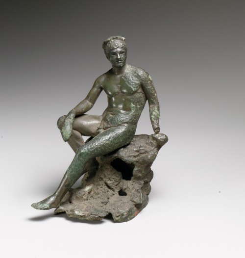 lionofchaeronea:Bronze statuette of Hermes/Mercury, seated on a rock and holding a purse.  Artist un