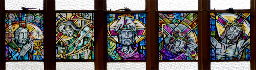 Scottish Highlanders and 5 of 30 laminated stained glass windows of the Stations of the Cross by Fel