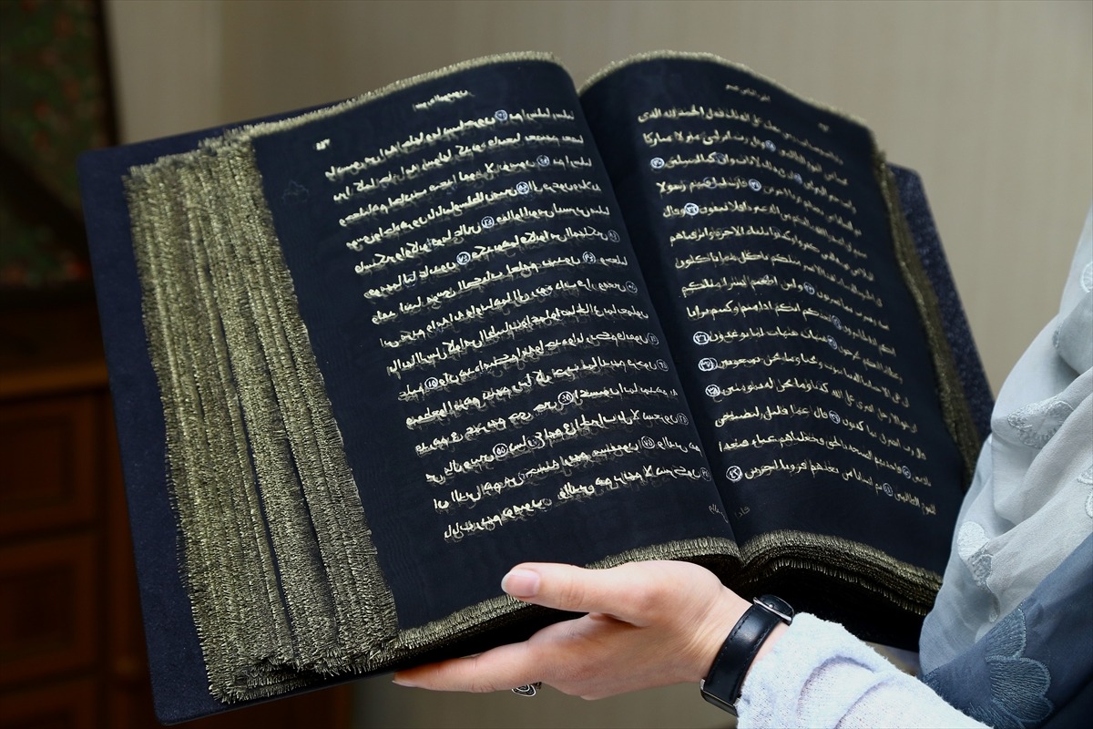 qmr:  Azerbaijani painter writes Quran on transparent silk pages Azerbaijani painter