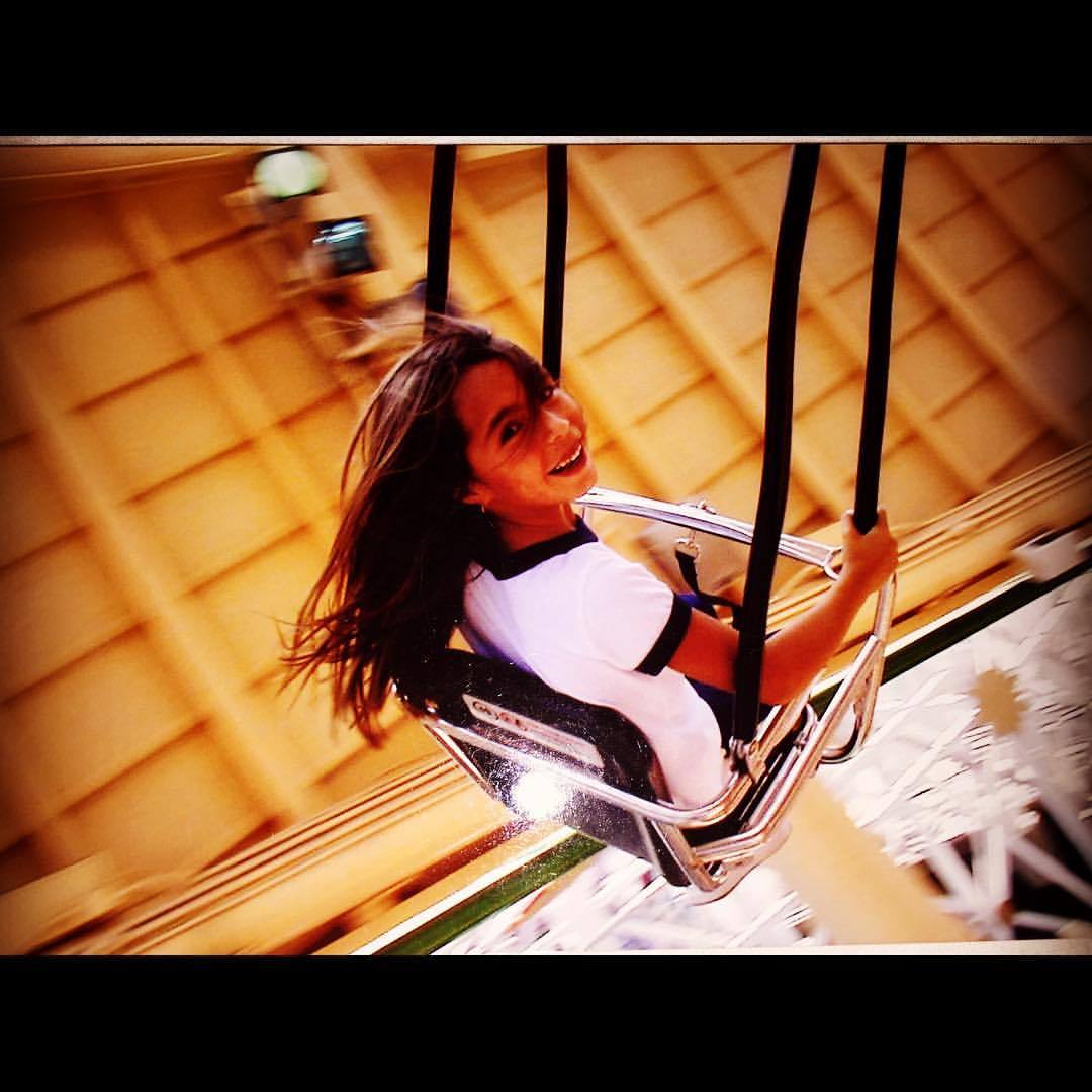 Monica on the swings at Disneyland! I took this pic. She was so cute! #monie  (at