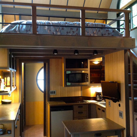 coacalin:  micromanor:  Hand Built Luxury Tiny House has Fireplace built into stairs