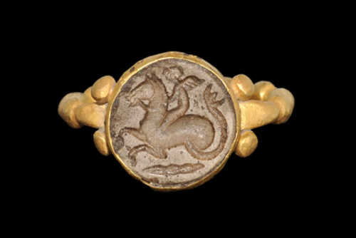 Ancient Greek gold ring with a stone intaglio of a hippocampus, dated to the 5th to 3rd centuries BC
