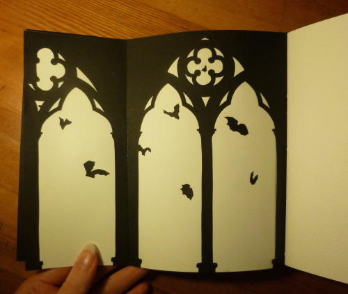 lorenzocheney:Here’s what I made for week 2 of bookbinding! It’s got cutouts of cathedrals and bats 