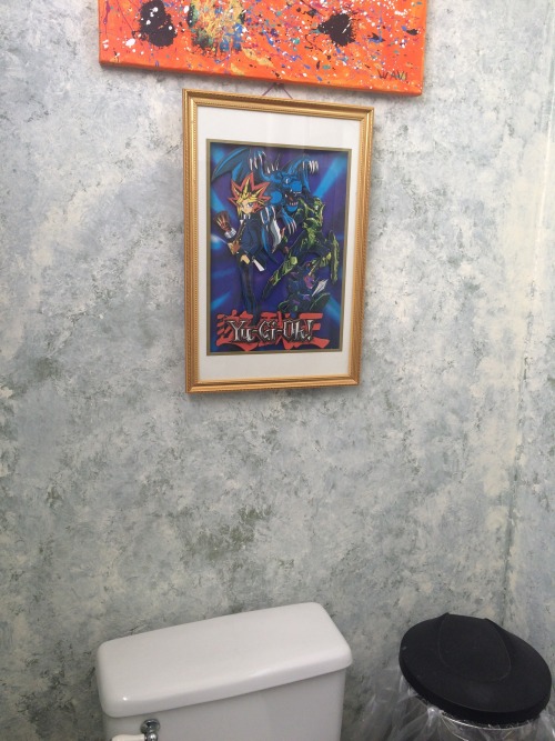 nemesismess:yamqguchi:im at a nice restaurant and in the bathroom they have a framed yugioh picture@