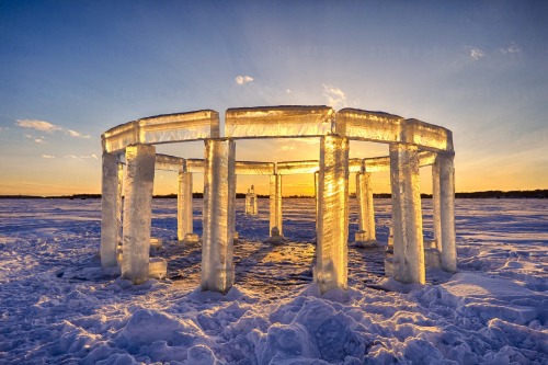 sixpenceee:Kevin Lehner, along with four other guys, created this Icehenge. Each piece was cut and pulled from the belly of the frozen lake. Using chainsaws, ice cutters, and tongs they built this homage to Stonehenge in two days. 