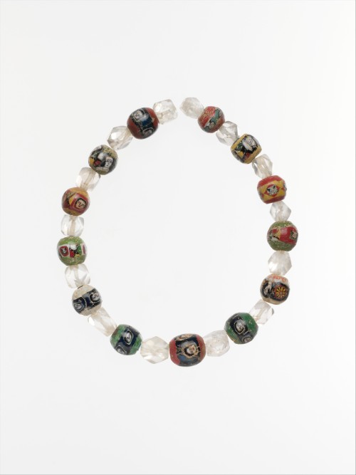 via-appia:Glass mosaic and rock crystal beads, decorated with faces or busts sometimes separated by 