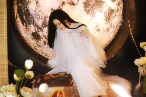 A Moon Festival-inspired white fantasy áo tấc, with elements of Hằng Nga, the moon goddess. The godd