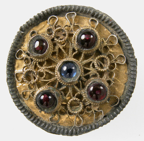 met-medieval-art:Disk Brooch via Medieval ArtMedium: Copper alloy, coated with gold, garnets, sapphi