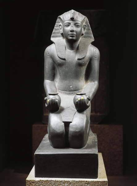 Schist statue of Ramesses IVKneeling statue of Ramesses IV making an offering of wine.New Kingdom, 2