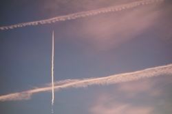 moonstreets:  airplanes make paint strokes in the sky 
