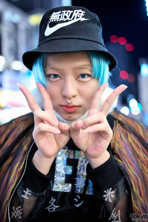 Shoshipoyo on the street in Harajuku wearing a Dog bomber over a Nikki Lipstick top with sheer kanji