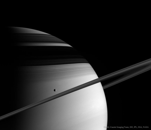 just&ndash;space: The ice moon Tethys passes in front of Saturns rings, photo taken in 2005 from