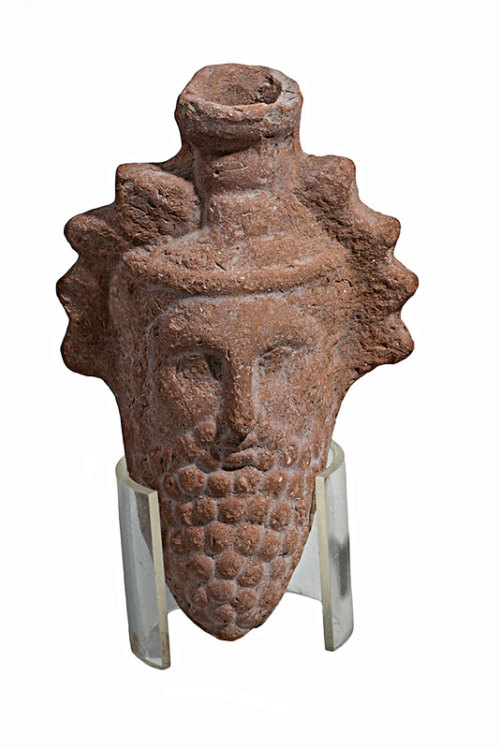 Dionysus Head FlaskA terracotta Dionysus head flask, from Faiyum, Ptolemaic Period305-30 BC. Now in 