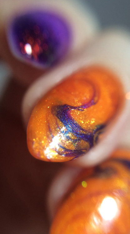 snailfart:  The cauldron spilled over. Purple ombre / jelly sandwich, bottom —› top: Zoya Miley L’Oreal Lilac Coolers L’Oreal Berry Nice Max Factor Fantasy Fire Kleancolor Chunky Holo Black Orange swirl dry marble: Sinful Colors Cloud 9 Sinful