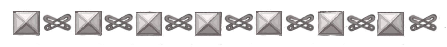 a divider of alternating pyramid studs and safety pins