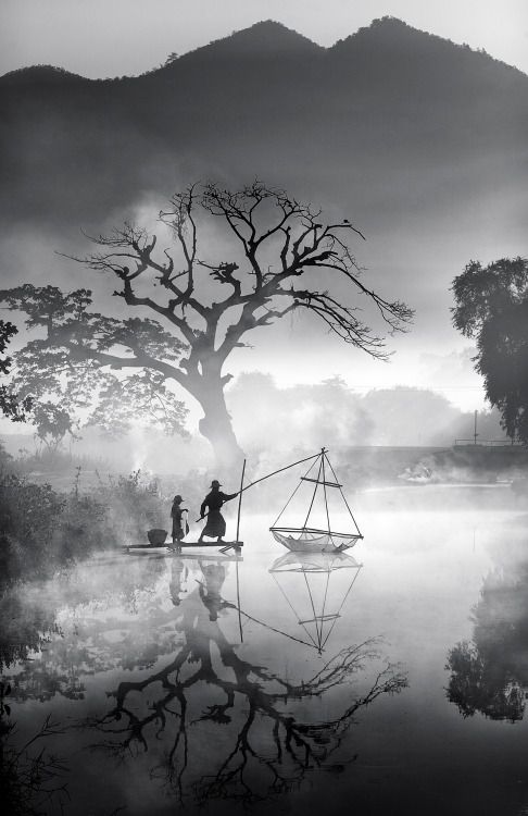 “Foggy Morning Fishing,” Myanmar,This scene shows a father and son catching fish early one winter mo