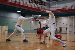 modernfencing:  prettycolorsandsharpthings:  Épée!  I’m super happy with how this photo turned out, especially since I was sitting on the floor being tired while I took it  [ID: an epee fencer hitting his opponent in the arm.] 