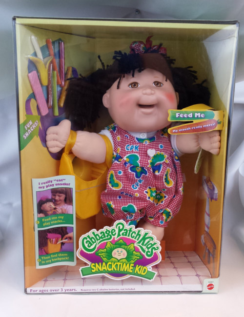 destructiontheory:This is a Cabbage Patch Kids Snacktime Kids doll from 1996. The eating doll with a