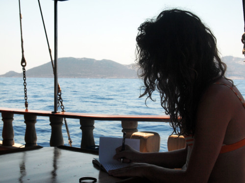Naked night swimming with glowing plankton, pulling shapes off the end of the boat into the turquois