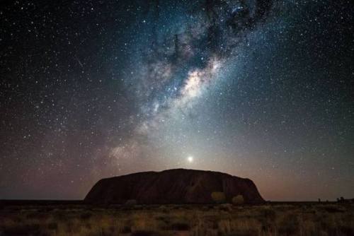 ancientorigins: Uluru, Resting Under The Milky Ways Galactic Arms, Australia.