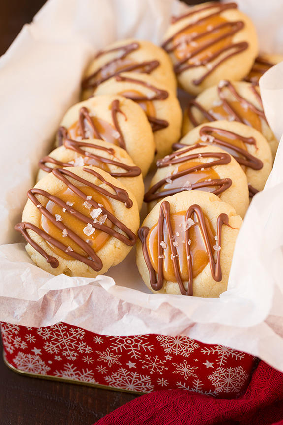 sweetoothgirl:  Twix Thumbprint Cookies  