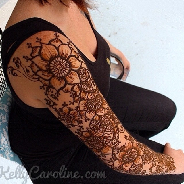 Henna by Kelly Caroline, A fun Henna tattoo sleeve with flowers and...