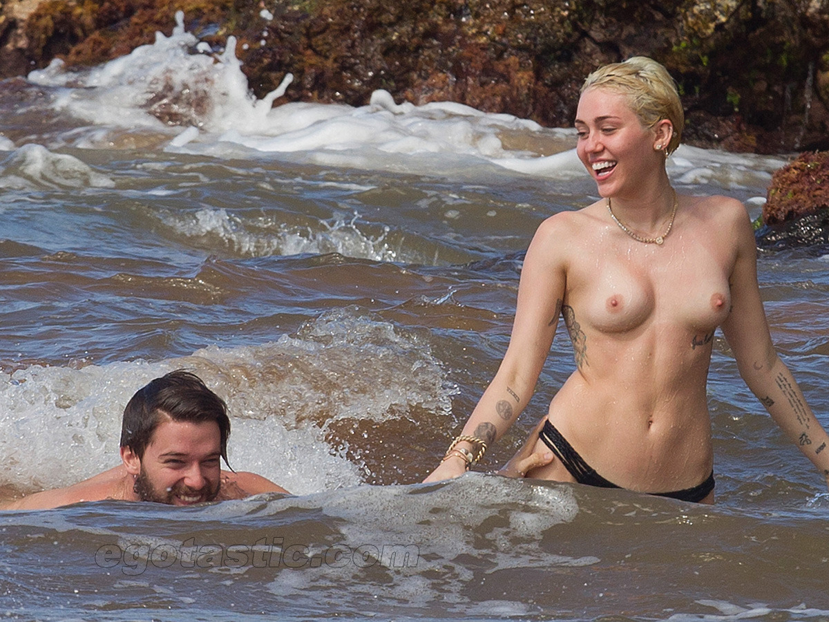 boobs4victory:   Miley Cyrus at the beach in Hawaii  with Patrick Schwarzenegger.