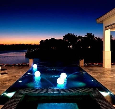 Infinity - PoolAn Illustration Of A Medium-sized Modern Backyard Design With A Custom-shaped Infinity