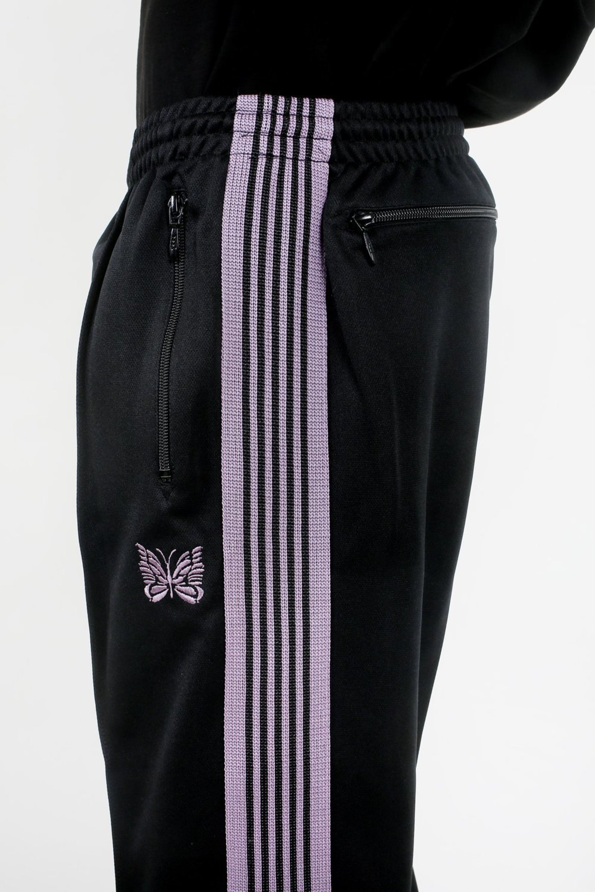 Butterfly logo on Needles track pants is inspired