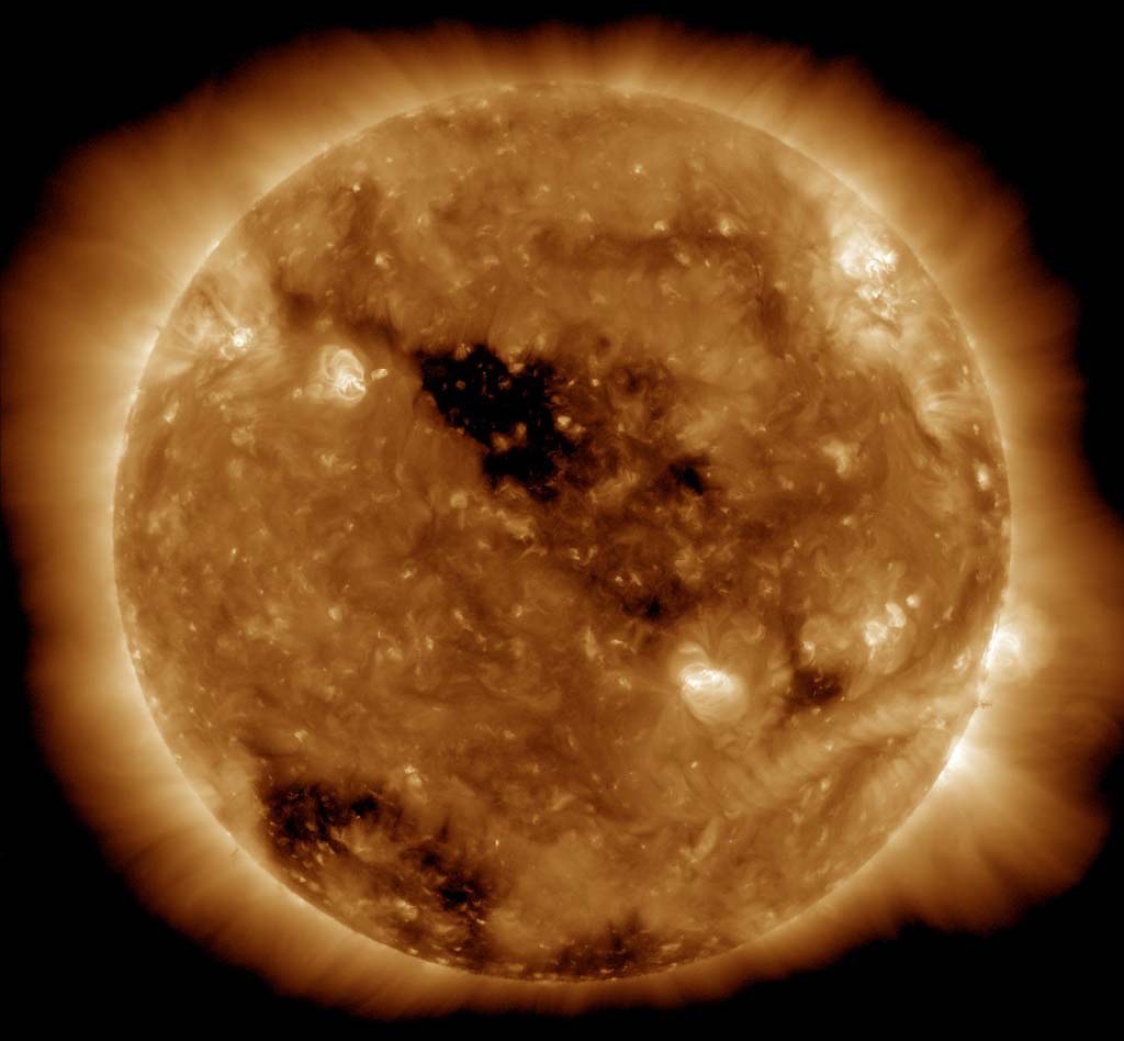 Holes in the Sun’s Corona by NASA Goddard Photo and Video