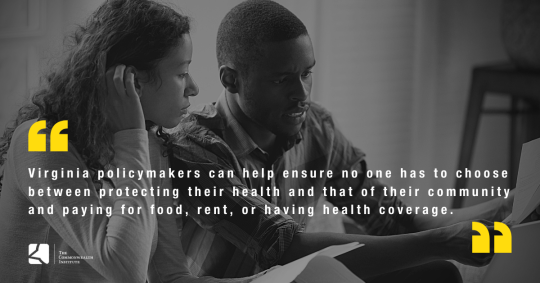 Young black couple looking concerned while reviewing some papers.