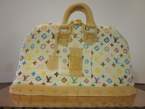 Louis Vuitton themed cake iced in butter icing with 3D han…