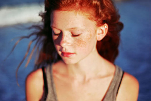 Girl with red hair freckles green eyes