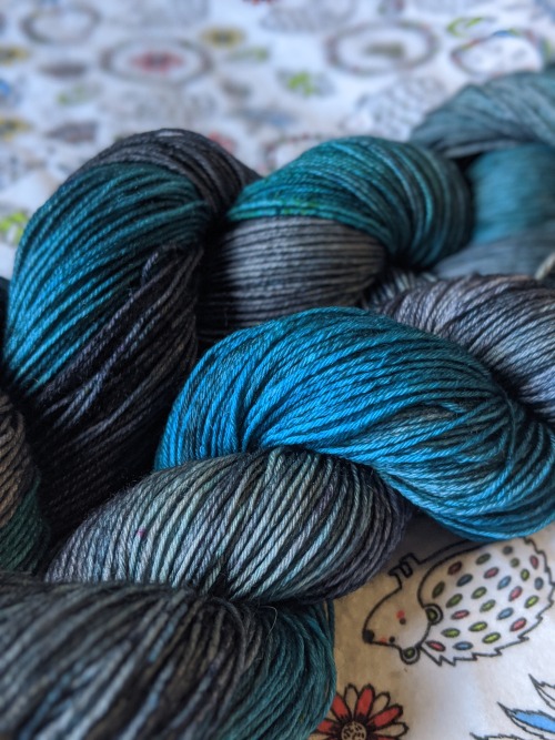 yarn that has distinct patches of blue and grey. both colours have some pleasing tonal variation