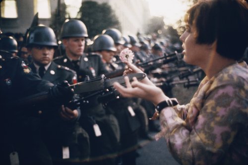 Photographer : Marc Riboud. Young girl with flower, 1967.