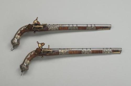 A pair of silver niello mounted miquelet pistols from the Caucasus/Circassia, dated 1789.from The St