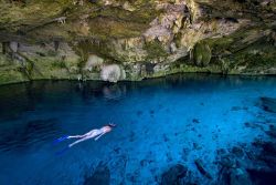 natgeotravel:  A snorkeler swims in a sparkling cenote in Mexico. Photograph by Emmanuel LATTES, Alamy
