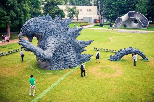 archiemcphee:  We aren’t sure how it happened, but Godzilla appears to have gotten stuck while walking through the gardens of Tokyo Midtown. He’s only visible from about the waist up (Godzilla has a waist, right?) along with a portion of his tail.