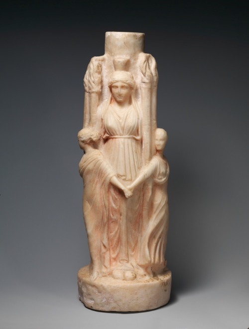 via-appia:Marble statuette of triple-bodied Hekate and the three Graces. Hekate presided over pathwa