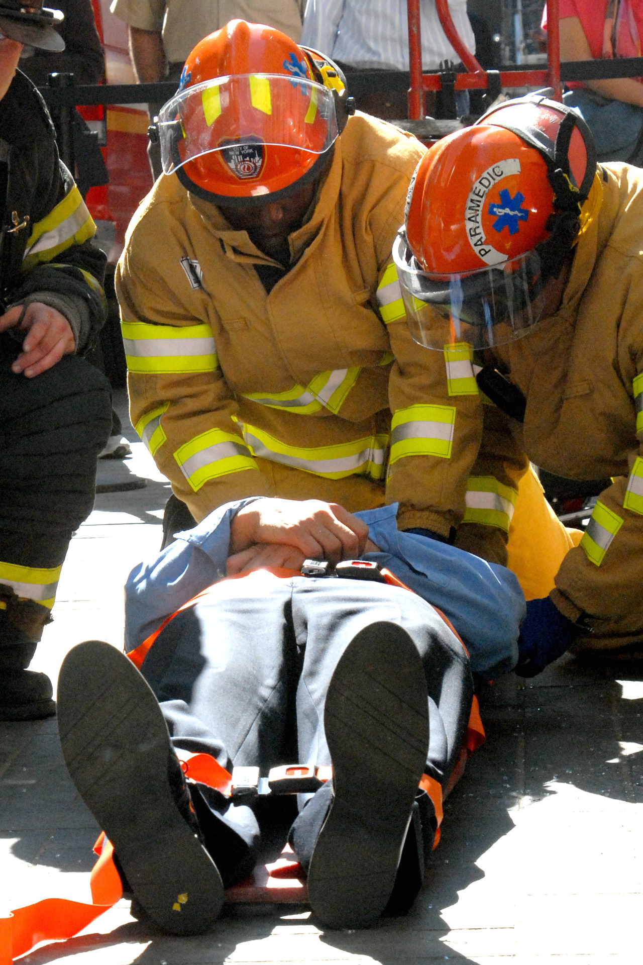 FDNY EMS members package a patient during a demonstration in Rockefeller Center, 2006.