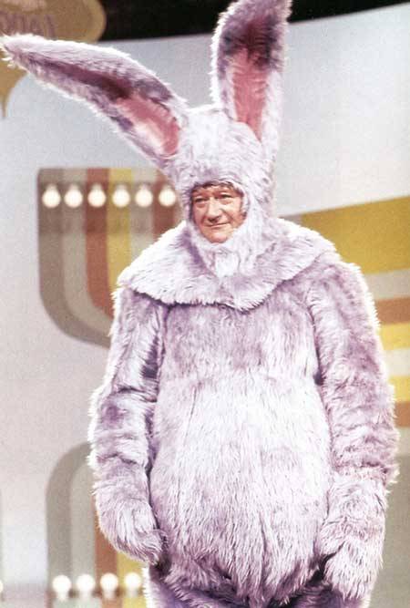 You want some chocolate, pilgrim? (John Wayne spoofs the Easter bunny on “Rowan