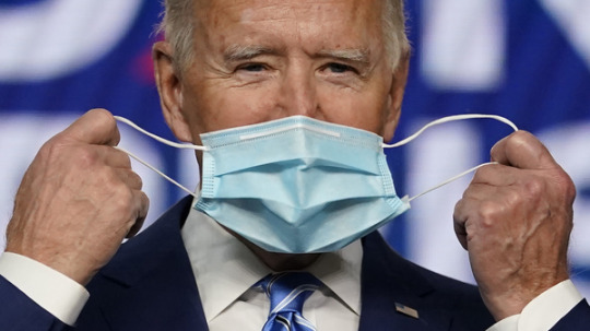 President Joe Biden, pictured on the campaign trail in Nov. 2020, has long encouraged Americans to mask up in the fight against COVID-19. On Wednesday, his administration announced it will provide 25 million masks to community health centers and food banks across the country.